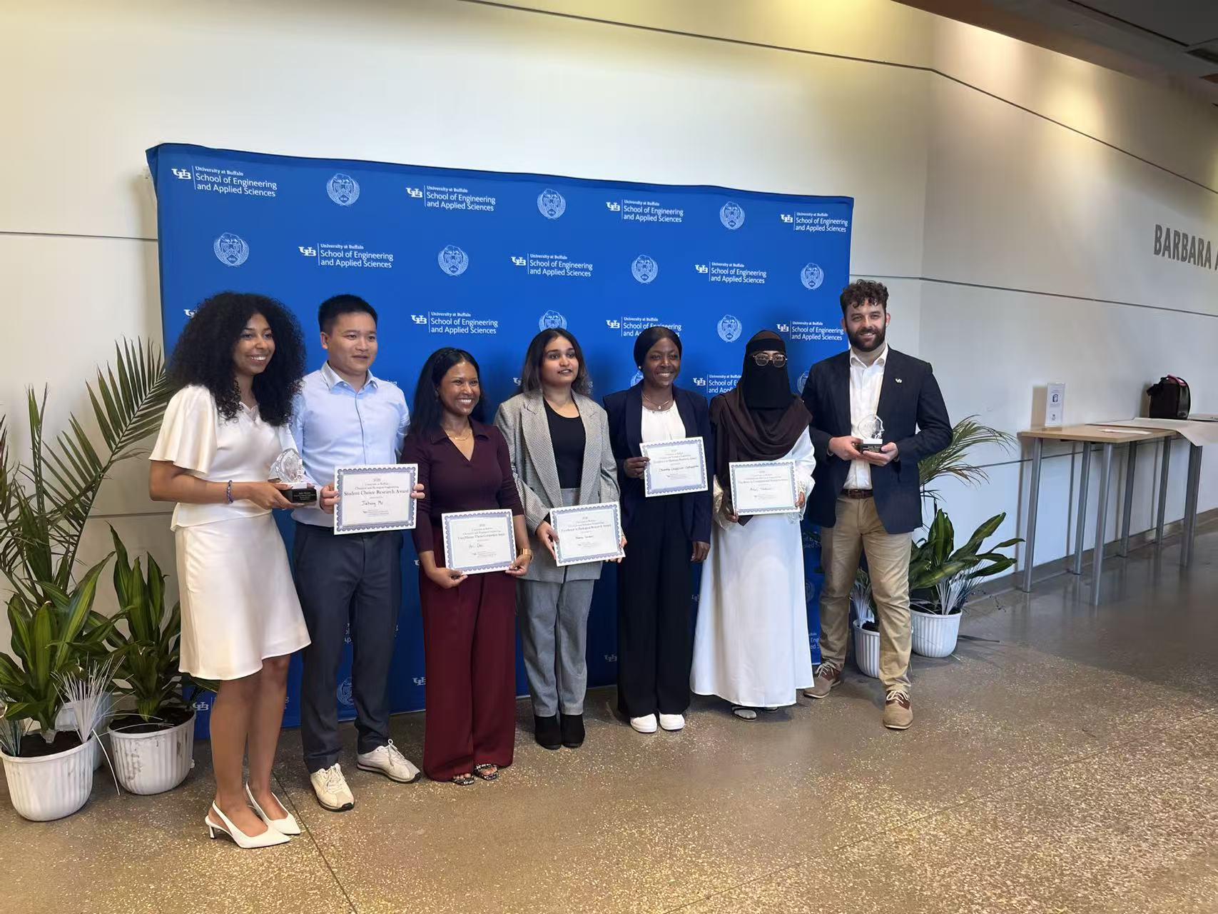 Areej receiving the award at the CBE Graduate Symposium